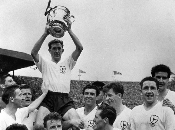 Tottenham Hotspur's captain Danny Blanchflower collects the 1961 FA Cup to add to the League Championship already won that season